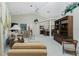 Spacious living room with plush seating, bright lighting, and decorative columns into the dining area at 1311 Pine Siskin Dr, Punta Gorda, FL 33950