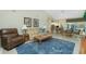 Spacious living room seamlessly connects to an open-concept kitchen and dining area, perfect for modern living at 1311 Pine Siskin Dr, Punta Gorda, FL 33950