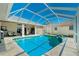 Enjoy the sunshine in this home's private, screened-in pool area with a beautiful design at 1311 Pine Siskin Dr, Punta Gorda, FL 33950