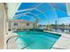 Relax by the pristine pool with a clear view of the canal, perfect for enjoying sunny afternoons at 1311 Pine Siskin Dr, Punta Gorda, FL 33950