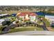 Stunning building with a red roof, beautiful landscaping, and plenty of parking at 1340 Rock Dove Ct # 132, Punta Gorda, FL 33950