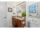 Bathroom with granite vanity top, bright vanity lighting, and tile floors at 1340 Rock Dove Ct # 132, Punta Gorda, FL 33950