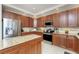 Well-equipped kitchen with custom cabinets, granite countertops, stainless steel appliances, and a functional center island at 1340 Rock Dove Ct # 132, Punta Gorda, FL 33950