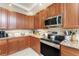 This kitchen has custom cabinets, granite countertops, stainless steel appliances, and ample counter space at 1340 Rock Dove Ct # 132, Punta Gorda, FL 33950