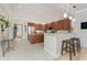Modern kitchen featuring granite countertops, stainless steel appliances, and a breakfast bar with pendant lighting at 1340 Rock Dove Ct # 132, Punta Gorda, FL 33950