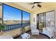 Screened lanai with water view, comfortable seating and access to the primary bedroom at 1340 Rock Dove Ct # 132, Punta Gorda, FL 33950