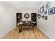 Charming office space with natural light, hardwood floors, decorative desk, and bookshelves creating a cozy atmosphere at 1340 Rock Dove Ct # 132, Punta Gorda, FL 33950