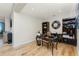 Comfortable office area with hardwood floors, a unique desk setup, bookshelves, and decorative accents at 1340 Rock Dove Ct # 132, Punta Gorda, FL 33950