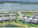 Aerial view of homes with pools in waterfront community, manicured landscaping at 16064 Shoreline Dr, Punta Gorda, FL 33982