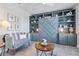 Charming bedroom featuring a blue built-in unit with shelving and storage cabinets at 16064 Shoreline Dr, Punta Gorda, FL 33982