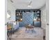 Charming bedroom featuring a blue built-in unit with shelving and storage cabinets at 16064 Shoreline Dr, Punta Gorda, FL 33982