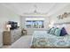 Inviting bedroom with a backyard view and stylish lamps flanking the comfortable bed at 16064 Shoreline Dr, Punta Gorda, FL 33982