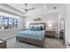 Inviting bedroom with a backyard view and stylish lamps flanking the comfortable bed at 16064 Shoreline Dr, Punta Gorda, FL 33982