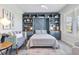 Charming bedroom featuring a blue built-in unit with shelving and storage cabinets at 16064 Shoreline Dr, Punta Gorda, FL 33982