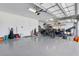Spacious garage with speckled epoxy flooring and ample storage for vehicles and equipment at 16064 Shoreline Dr, Punta Gorda, FL 33982