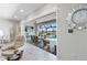 Open floorplan with view from the living room to the patio, pool, and lake at 16064 Shoreline Dr, Punta Gorda, FL 33982