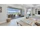Bright open living space with views of the screened-in patio, pool, and lake at 16064 Shoreline Dr, Punta Gorda, FL 33982