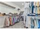 Spacious walk-in closet with ample shelving and clothing racks for optimal storage at 16064 Shoreline Dr, Punta Gorda, FL 33982