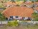 Overhead view of a property with tile roofing, lush greenery, and well-maintained landscaping at 16308 Sunset Palms Blvd # 1702, Punta Gorda, FL 33955
