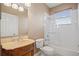 Bathroom featuring a single sink, shower/bath combo, and neutral tile at 16308 Sunset Palms Blvd # 1702, Punta Gorda, FL 33955