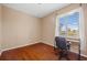 Office bedroom with hardwood floors, large window, a desk and chair at 16308 Sunset Palms Blvd # 1702, Punta Gorda, FL 33955