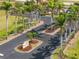 Scenic view of the Sunset Palms community entrance, featuring lush palm trees and landscaping at 16308 Sunset Palms Blvd # 1702, Punta Gorda, FL 33955