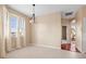 Airy dining area bathed in natural light from the three windows and a modern hanging light fixture at 16308 Sunset Palms Blvd # 1702, Punta Gorda, FL 33955