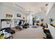 Bright gym with an assortment of exercise equipment and mirrored wall; great fitness space at 16308 Sunset Palms Blvd # 1702, Punta Gorda, FL 33955