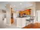 Open kitchen layout with a breakfast bar, wooden cabinets, and a stainless steel appliance package at 16308 Sunset Palms Blvd # 1702, Punta Gorda, FL 33955
