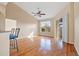 Bright living room with hardwood floors, high ceilings, and a ceiling fan and sliding door to outside at 16308 Sunset Palms Blvd # 1702, Punta Gorda, FL 33955