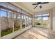 Bright sunroom with tile floors and multiple windows offering views of the outdoors at 16308 Sunset Palms Blvd # 1702, Punta Gorda, FL 33955