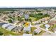 Peaceful aerial view of home, nestled by a serene lake and lush green landscaping, perfect for relaxation at 1848 Birmingham Blvd, Port Charlotte, FL 33980