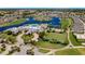 Stunning aerial view of community featuring a pool, tennis courts, and manicured green spaces at 1848 Birmingham Blvd, Port Charlotte, FL 33980
