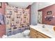 Cozy bathroom featuring a white sink vanity and charming lighthouse-themed shower curtain at 1848 Birmingham Blvd, Port Charlotte, FL 33980