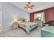 Inviting bedroom decorated with tropical accents, wicker furniture, and a ceiling fan at 1848 Birmingham Blvd, Port Charlotte, FL 33980