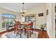 Inviting dining room with hardwood floors, natural lighting, and cozy decor at 1848 Birmingham Blvd, Port Charlotte, FL 33980