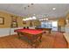 Community game room with full-size billiards tables and overhead lighting at 1848 Birmingham Blvd, Port Charlotte, FL 33980
