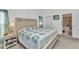 Comfortable bedroom with a decorative headboard, bedside table and lamps at 1848 Birmingham Blvd, Port Charlotte, FL 33980