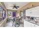Cozy sun room with neutral tones, ceiling fan, and furniture with views of the backyard at 1848 Birmingham Blvd, Port Charlotte, FL 33980
