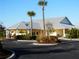 Community clubhouse featuring lush landscaping and well-maintained common areas at 2060 Willow Hammock Cir # 207, Punta Gorda, FL 33983