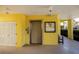 Hallway with elevator, exterior door, and community information displayed on the wall at 2060 Willow Hammock Cir # 207, Punta Gorda, FL 33983