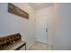 Entryway with white walls, a mermaid wall decoration, and neutral decor at 2060 Willow Hammock Cir # 207, Punta Gorda, FL 33983