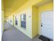 Condo hallway with unit number 207 and a white entry door at 2060 Willow Hammock Cir # 207, Punta Gorda, FL 33983