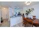 Bright kitchen features an open layout with modern appliances and views to the front door and a dining table with wood chairs at 2060 Willow Hammock Cir # 207, Punta Gorda, FL 33983
