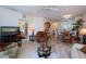 Spacious living room with comfortable seating, modern decor, and natural light, blending seamlessly with dining area at 2060 Willow Hammock Cir # 207, Punta Gorda, FL 33983