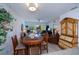 The living and dining areas share an open floorplan with a sliding glass door to the lanai at 2060 Willow Hammock Cir # 207, Punta Gorda, FL 33983