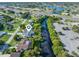 Aerial view shows the home's location on the water near shopping and major roads at 2095 Ellery St, Port Charlotte, FL 33952