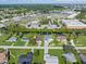 Wide aerial shows the home's location near the water and easy access to shopping at 2095 Ellery St, Port Charlotte, FL 33952