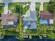 Aerial view of the property highlights the home's proximity to the water at 2095 Ellery St, Port Charlotte, FL 33952