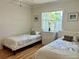 Bedroom featuring twin beds, a dresser and window with white blinds at 2095 Ellery St, Port Charlotte, FL 33952